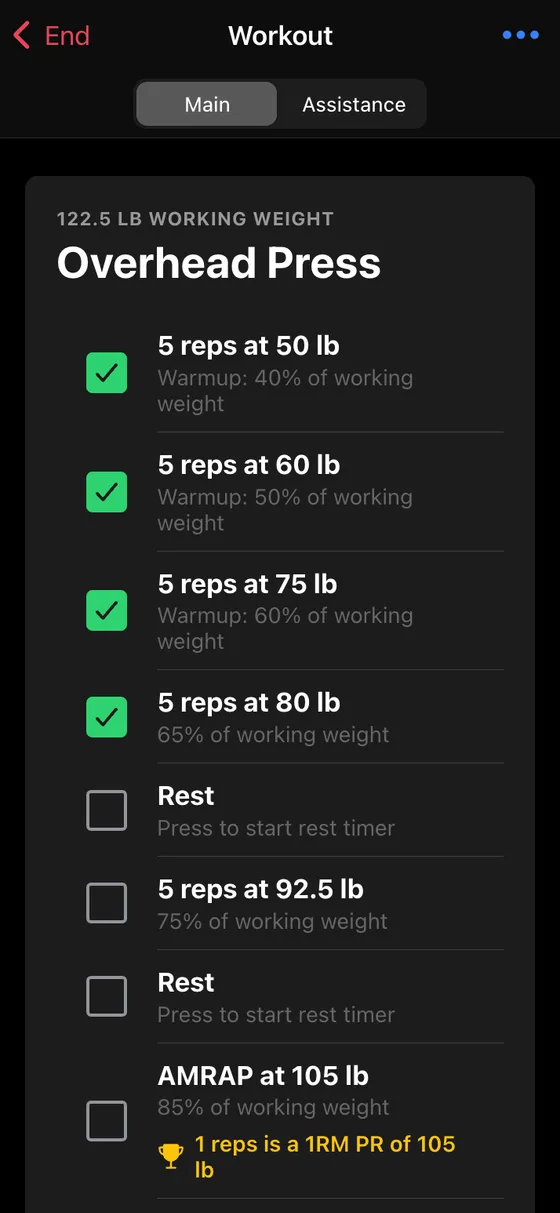 Wendler Log workout screen showing warmup sets checked off and the AMRAP top set at 105 lb